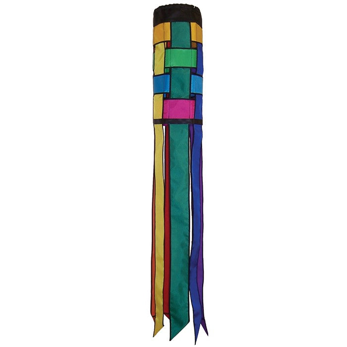 Colorful Rainbow Weave 40" Windsock with black edging and fluttering tails displayed outdoors, showcasing vivid colors against the backdrop.