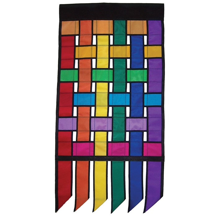 Rainbow Weave House Banner Tails featuring bright, interwoven colors fluttering in the outdoor breeze, perfect for garden decoration.