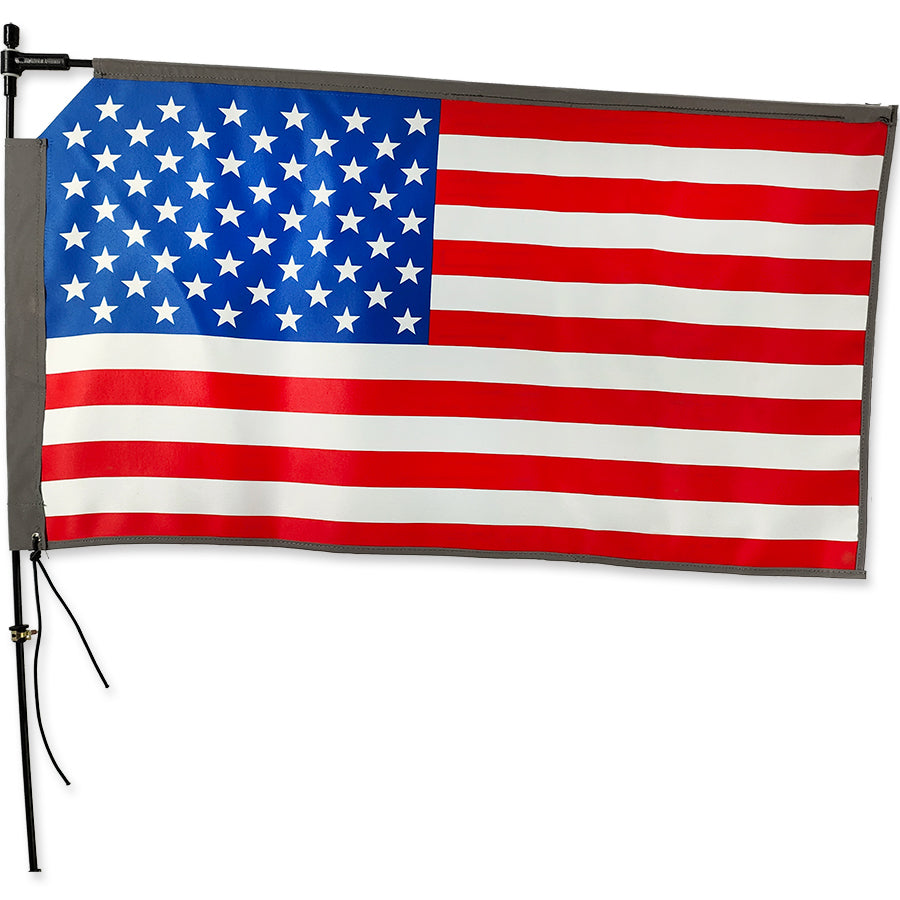 Rectangular Bike Flag with United States design flying on a bike, showcasing bright colors and reflective edges for visibility.