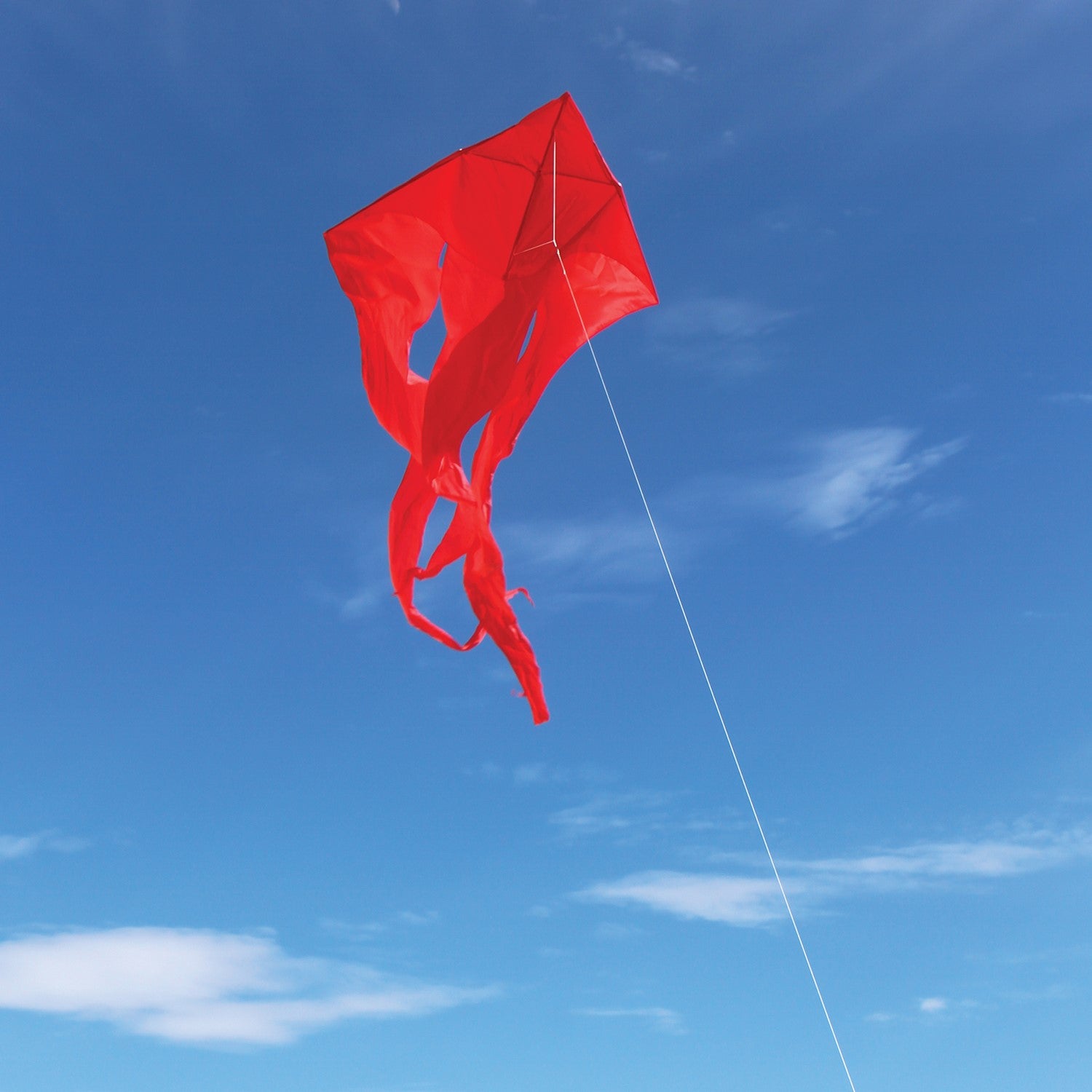 Red 77' Wave Delta Kite soaring in the sky with long flowing tails visible, showcasing its vibrant color and impressive size against a clear backdrop.