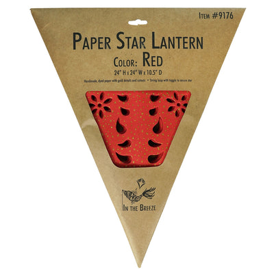 A Red Paper Star Lantern with intricate cutouts, elegantly hanging and illuminated, showcasing its vibrant color and gold accents in warm light.