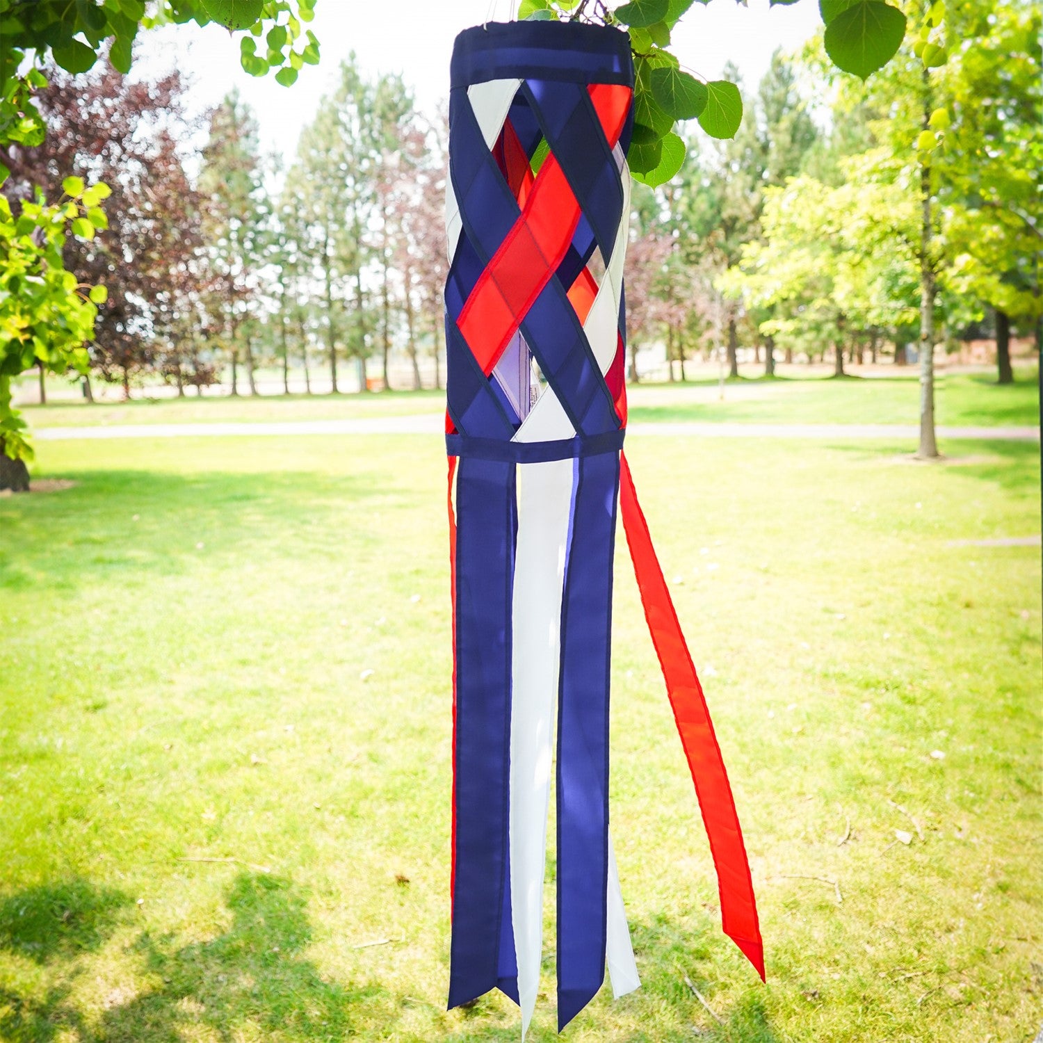 40-inch Red, White & Blue Diagonal Weave Windsock hanging outdoors, showcasing vibrant colors fluttering in the breeze.