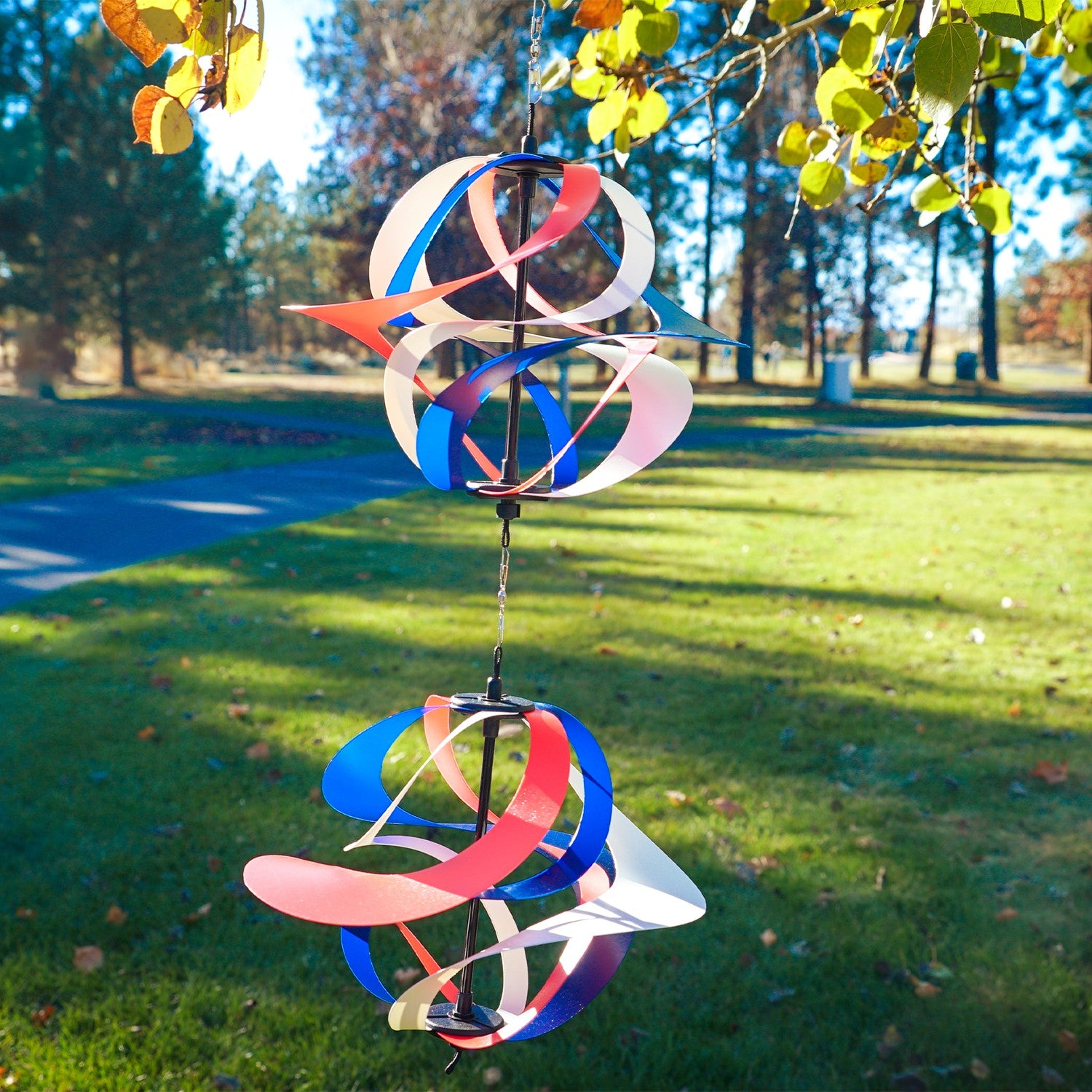 Red, White and Blue Poly Vortex Double Spinner featuring interconnected spirals, swirling in the wind, enhancing outdoor decor with patriotism.
