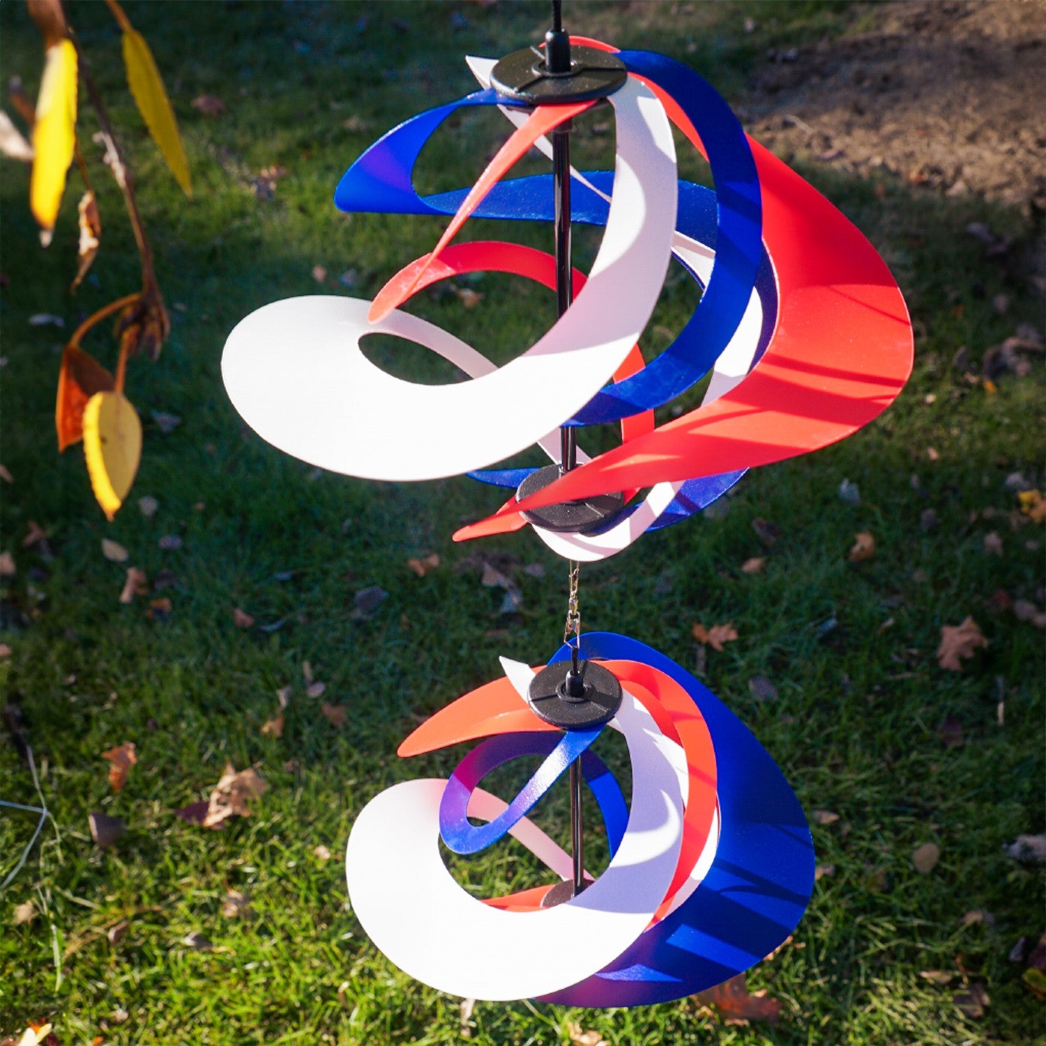 Red, White and Blue Poly Vortex Double Spinner featuring interconnected spirals, swirling in the wind, enhancing outdoor decor with patriotism.