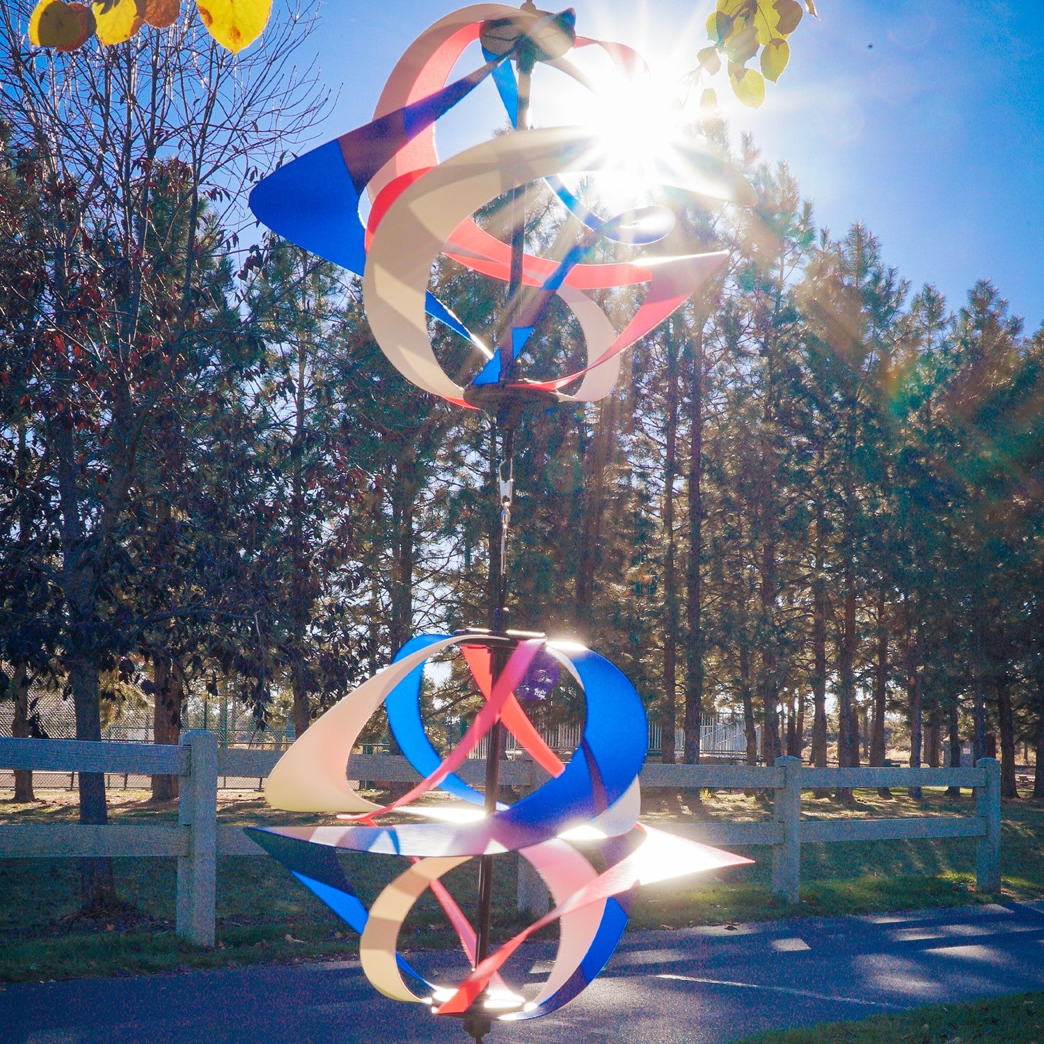 Red, White and Blue Poly Vortex Double Spinner featuring interconnected spirals, swirling in the wind, enhancing outdoor decor with patriotism.