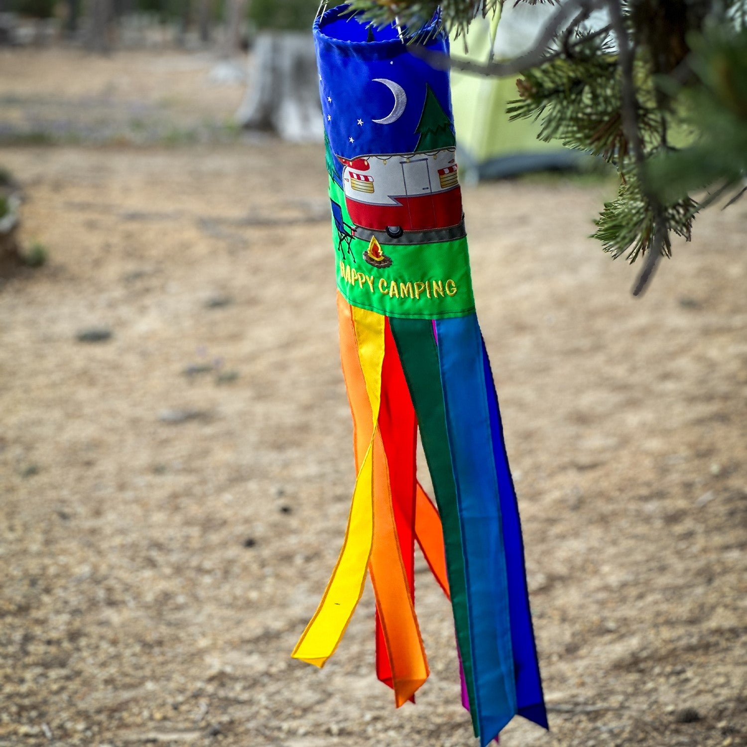 Retro Trailer 40" Windsock with colorful design and fluttering tails, hanging outdoors in a breezy setting, perfect for camping decor.
