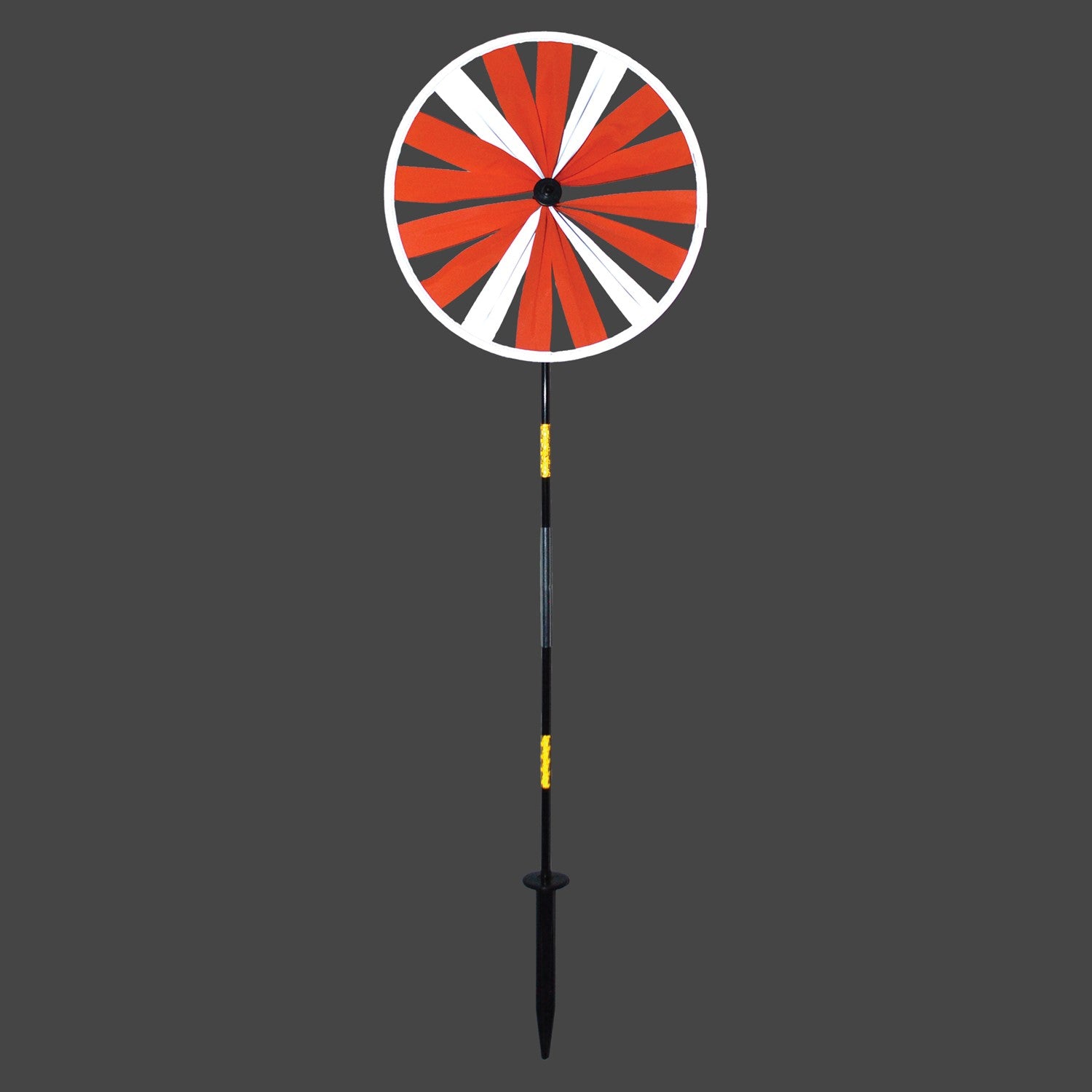 Retroreflective Orange 12' Spinner Wheel with glowing neon color displayed in a driveway setting, showcasing its reflective properties and weather-resistant design.