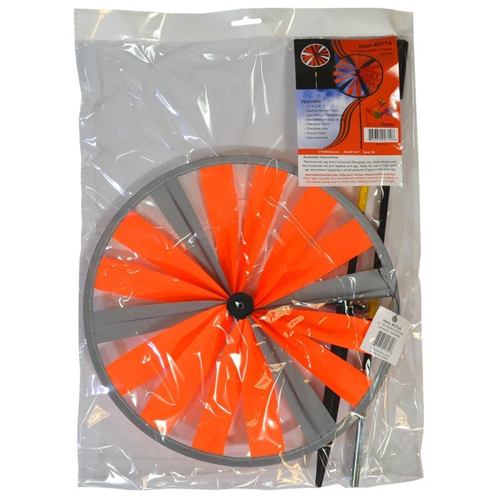 Retroreflective Orange 12' Spinner Wheel with glowing neon color displayed in a driveway setting, showcasing its reflective properties and weather-resistant design.