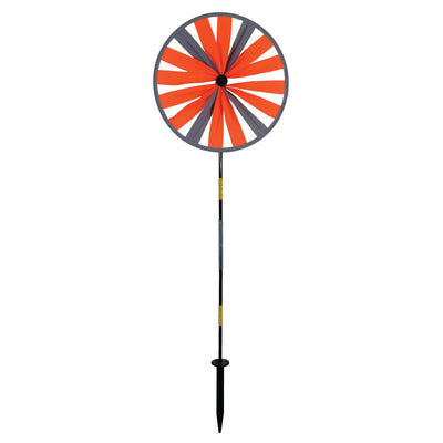 Retroreflective Orange 12' Spinner Wheel with glowing neon color displayed in a driveway setting, showcasing its reflective properties and weather-resistant design.