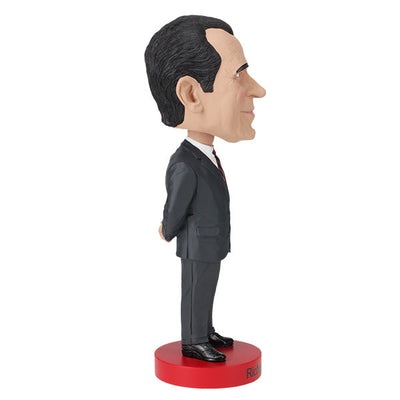 Richard Nixon bobblehead standing 8 inches tall, hand-painted with intricate details, displayed on a shelf against a neutral background.