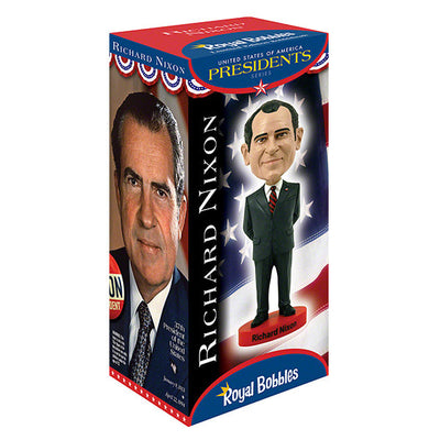 Richard Nixon bobblehead standing 8 inches tall, hand-painted with intricate details, displayed on a shelf against a neutral background.