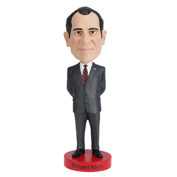 Richard Nixon bobblehead standing 8 inches tall, hand-painted with intricate details, displayed on a shelf against a neutral background.