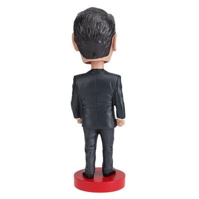 Ronald Reagan Bobblehead, a handcrafted 7-inch figure depicting the 40th President with a smiling expression, detailed suit, and in a collector's box.