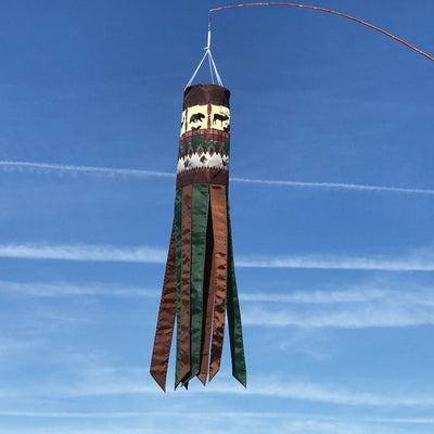 Rustic Lodge 40-inch windsock featuring bear and deer designs, suspended outdoors with colorful tails fluttering in the wind.