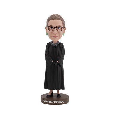 Ruth Bader Ginsburg bobblehead featuring her signature black robe, glasses, and earrings, displayed on a shelf as a tribute to her legacy.