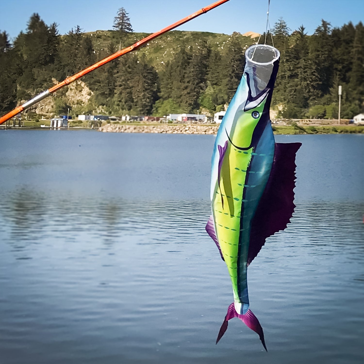 Sailfish 50 inch Fish Windsock hanging from a dock, showcasing vibrant colors and realistic design of sailfish in motion.