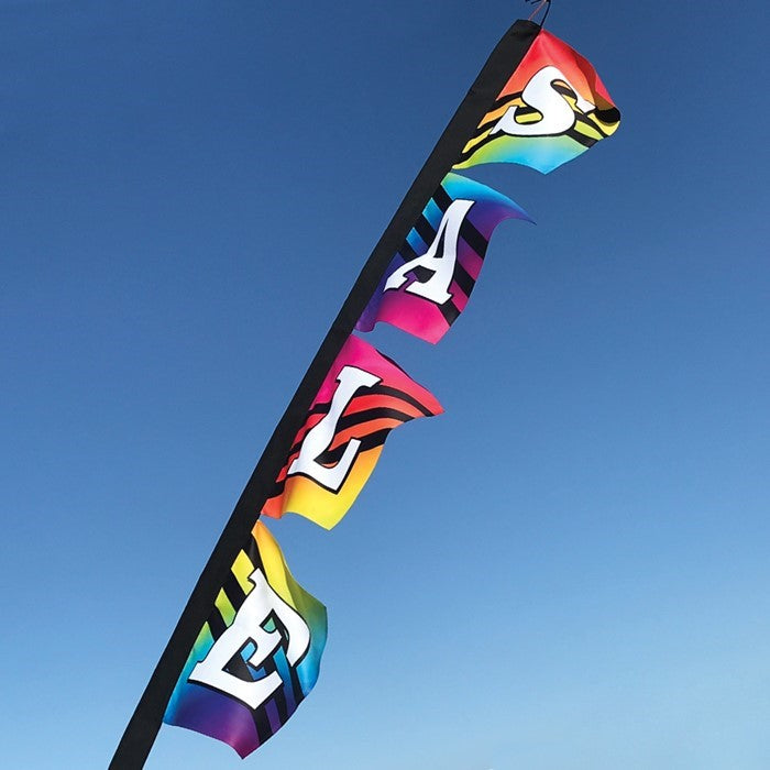 SALE Rainbow 4-Section Banner with vibrant colors, displayed outdoors, featuring eye-catching graphics designed to attract customers.