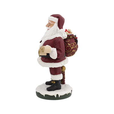 Santa Claus Bobblehips holiday bobblehead standing on a shelf, showcasing vibrant colors and intricate details, perfect for festive decoration.