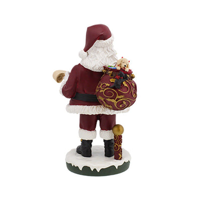 Santa Claus Bobblehips holiday bobblehead standing on a shelf, showcasing vibrant colors and intricate details, perfect for festive decoration.