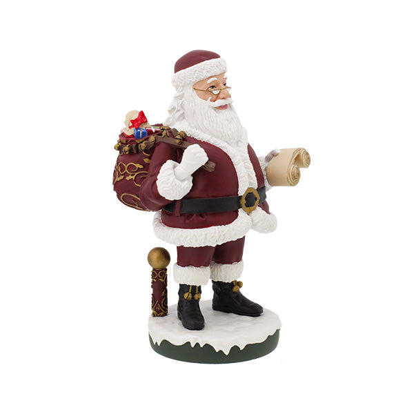 Santa Claus Bobblehips holiday bobblehead standing on a shelf, showcasing vibrant colors and intricate details, perfect for festive decoration.