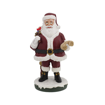 Santa Claus Bobblehips holiday bobblehead standing on a shelf, showcasing vibrant colors and intricate details, perfect for festive decoration.