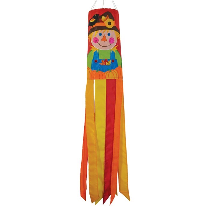 Scarecrow 40" Windsock displayed outdoors, featuring vibrant autumn colors and delightful scarecrow design with fluttering tails in a garden setting.