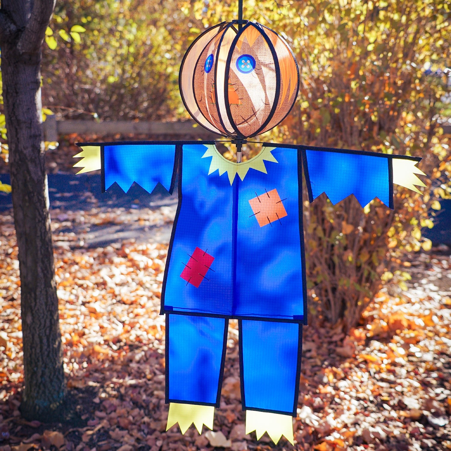 Scarecrow Hanging Ball Spinner made of weather-resistant materials, showcasing a friendly scarecrow head spinning in the wind to bring seasonal joy to your garden.