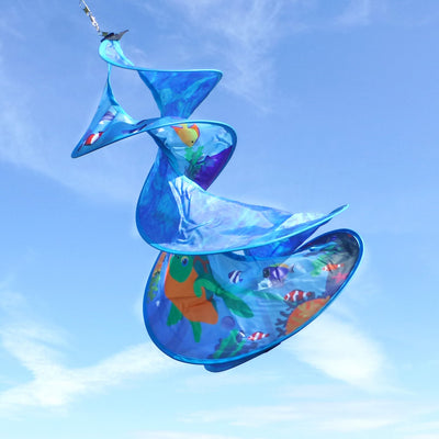 Sea Swimmers Spin Duet hanging garden decor featuring vibrant sea turtles spinning against a backdrop of ocean waves in an outdoor setting.