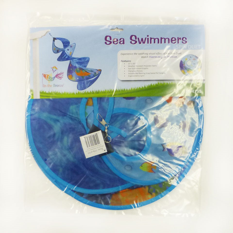 Sea Swimmers Spin Duet hanging garden decor featuring vibrant sea turtles spinning against a backdrop of ocean waves in an outdoor setting.