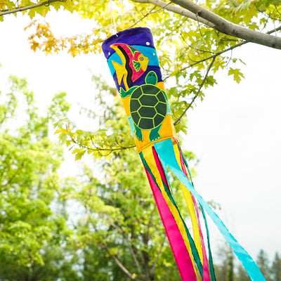 Sealife Turtle 40-inch windsock with bright colors and appliqued graphics, featuring a turtle design and fluttering tails displayed in an outdoor setting.