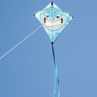 Shark 30" Diamond Kite with vibrant great white shark design flying high against a clear blue sky, showcasing its color-coordinated tails.