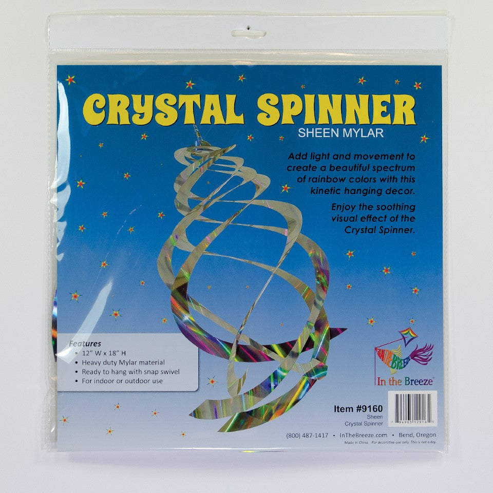 Sheen Crystal Spinner made of holographic Mylar, featuring five spinning blades reflecting rainbow colors, hanging in a garden with sunlight.