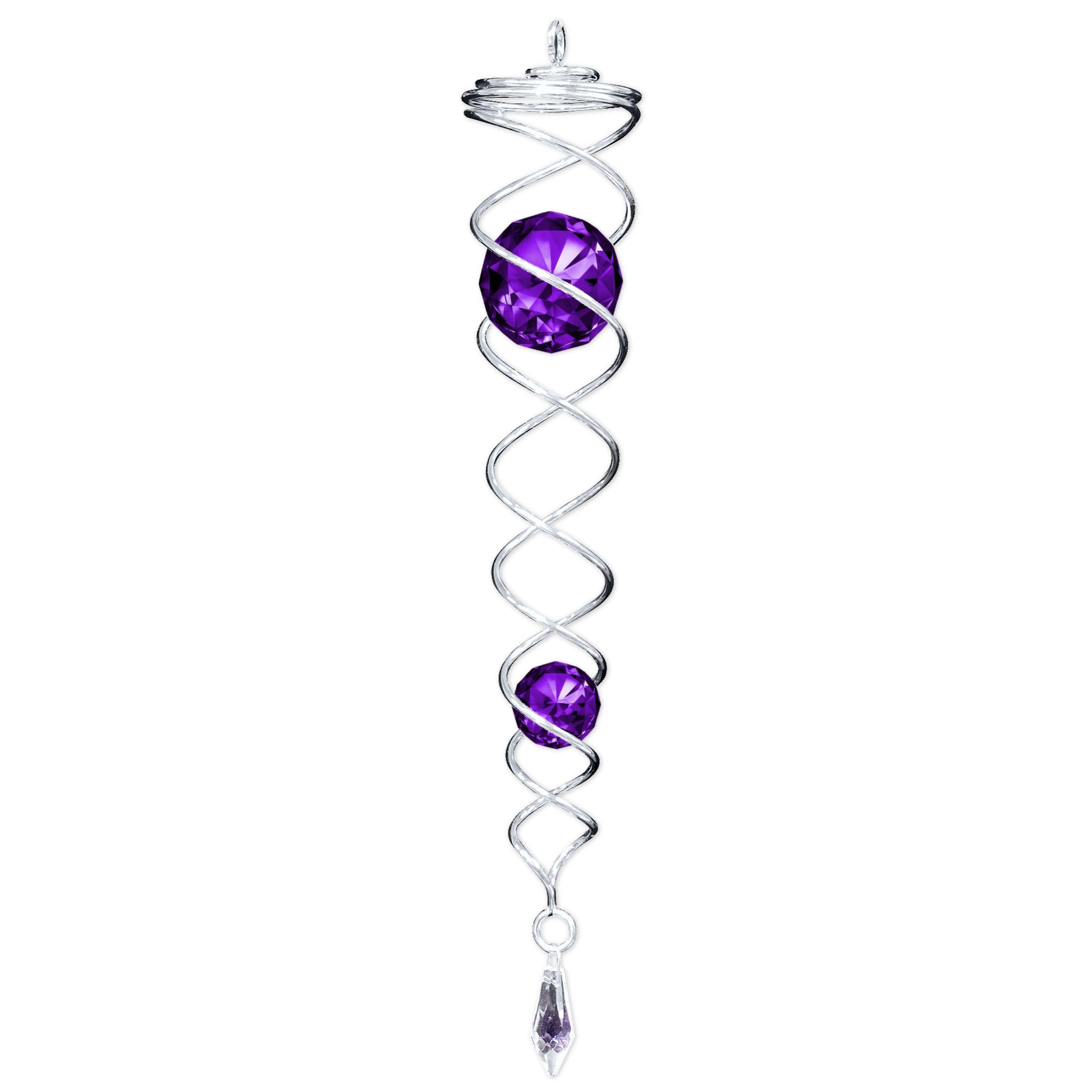 Silver Purple Crystal Twister in a garden setting, featuring two sparkling crystals that catch the light, creating motion and beauty.