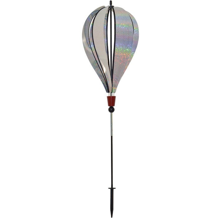 Silver Sparkle 6-Panel Hot Air Balloon Ground Spinner made of shimmering Mylar, elegantly displayed in a garden setting under sunlight.