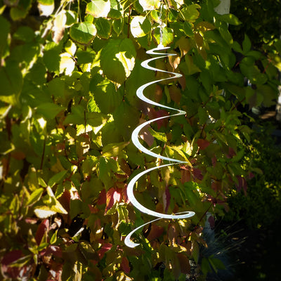 Silver Sparkle Lil' Sprite twirling elegantly in the breeze, crafted from durable Mylar for stunning indoor and outdoor decoration.