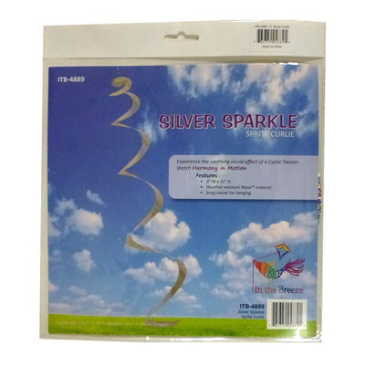 A Silver Sparkle Sprite hanging decor made from shimmering Mylar, gently twirling in a light breeze against a garden backdrop.