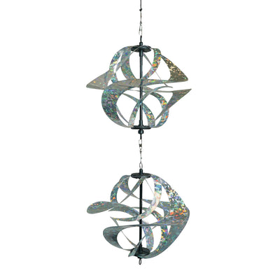 Silver Sparkle Vortex Double Spinner featuring interconnected Mylar spirals, elegantly spinning in an outdoor garden setting.