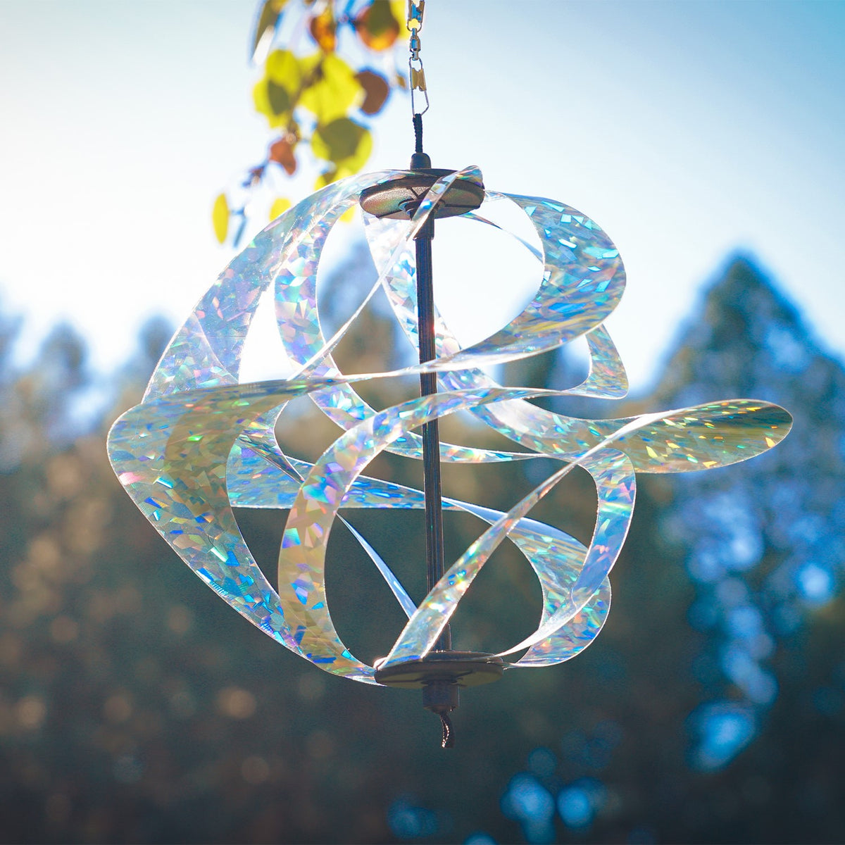 Silver Sparkle Vortex Spinner hanging freely from garden hook, showcasing sparkling Mylar spirals dancing in the sunlight.