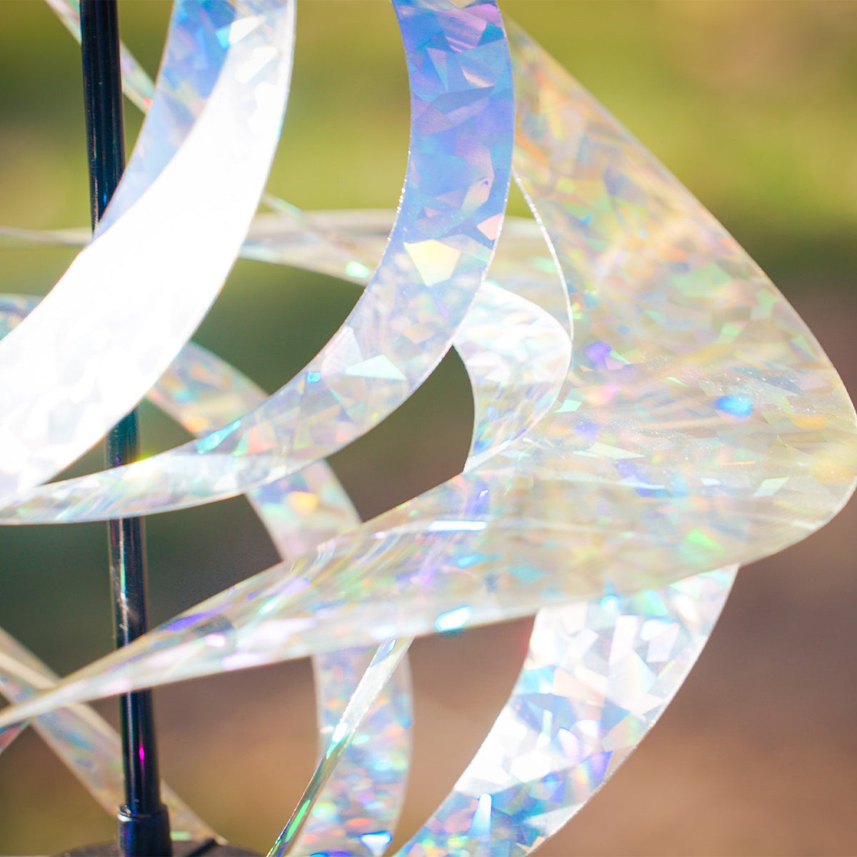 Silver Sparkle Vortex Spinner hanging freely from garden hook, showcasing sparkling Mylar spirals dancing in the sunlight.