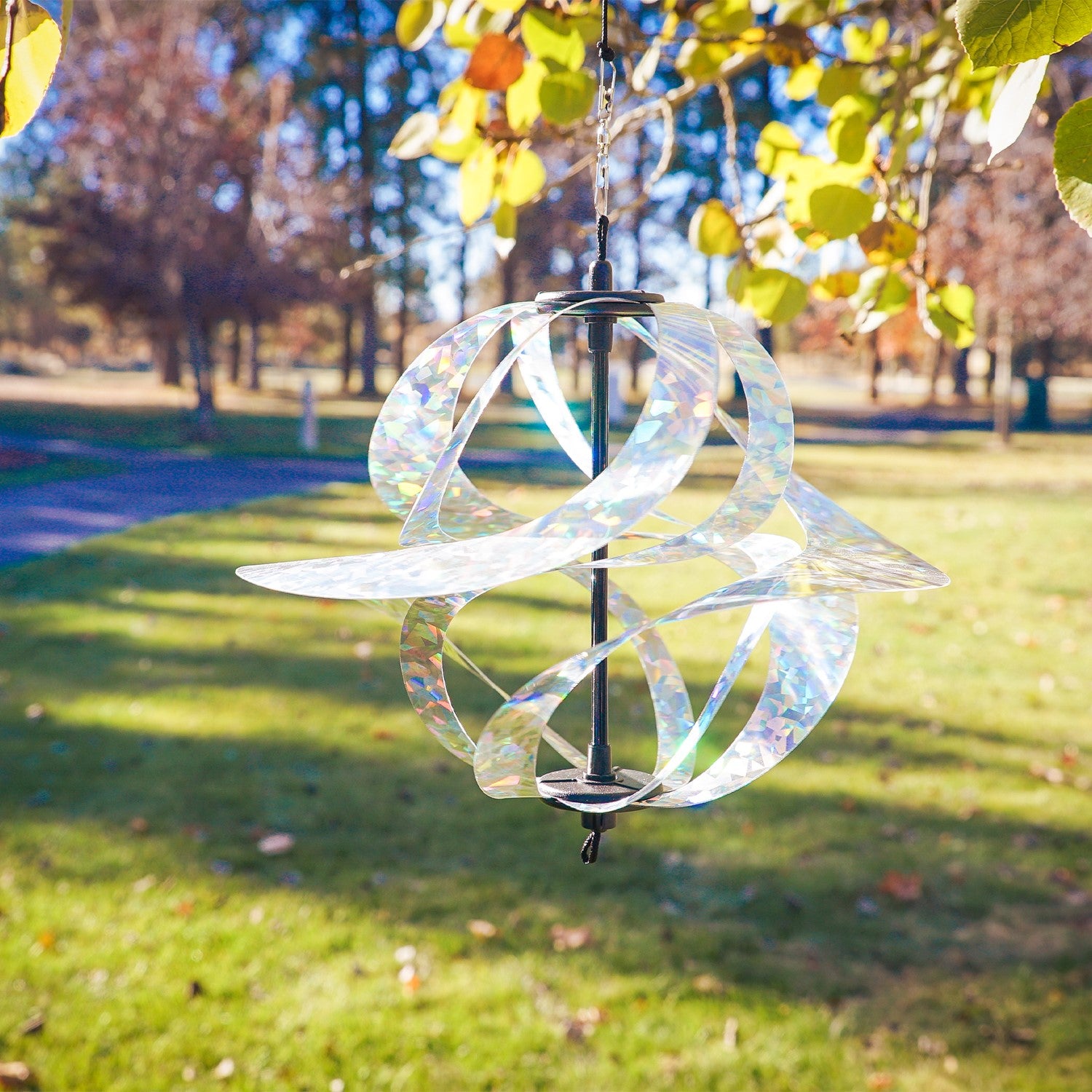 Silver Sparkle Vortex Spinner hanging freely from garden hook, showcasing sparkling Mylar spirals dancing in the sunlight.