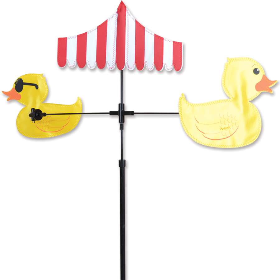 Colorful Single Carousel Spinner featuring duck designs, spinning gently in a garden setting, bringing liveliness and charm to the outdoor landscape.