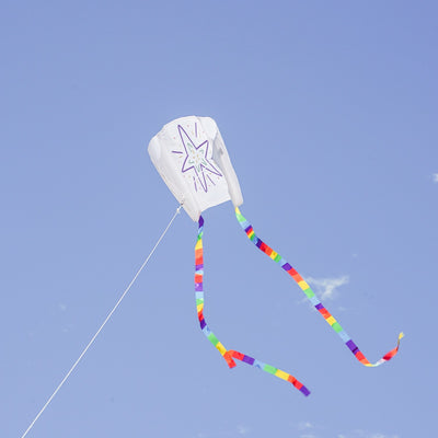 Sled Coloring Kite made of white ripstop fabric, featuring rainbow-striped tails, ready for personal decoration with crayons for an enjoyable outdoor experience.