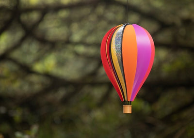Small Carnival Hot Air Balloon garden spinner displaying 10 colorful poly panels, spinning gently in a garden setting.