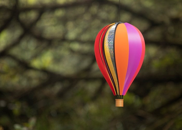 Small Carnival Hot Air Balloon garden spinner displaying 10 colorful poly panels, spinning gently in a garden setting.