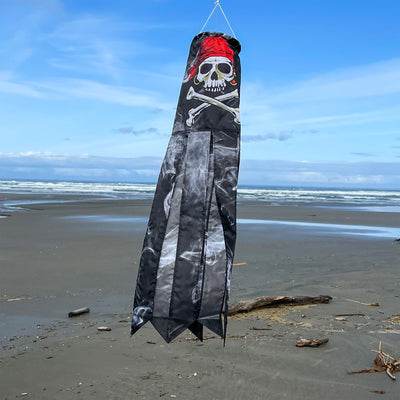Smokin' Pirate 30' windsock with a detailed printed skull and bones design, suspended in the air against a blue sky backdrop.