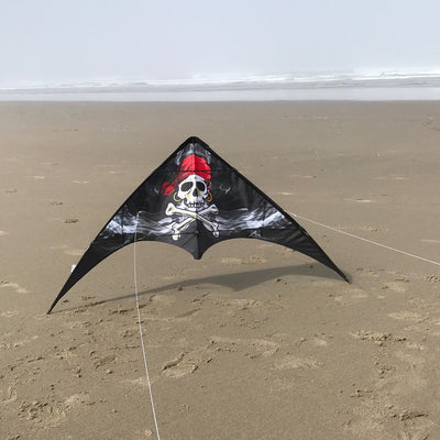 Smokin' Pirate 48" Sport Kite soaring in the sky with a Jolly Roger design, showcasing its vibrant colors against a sunny backdrop.