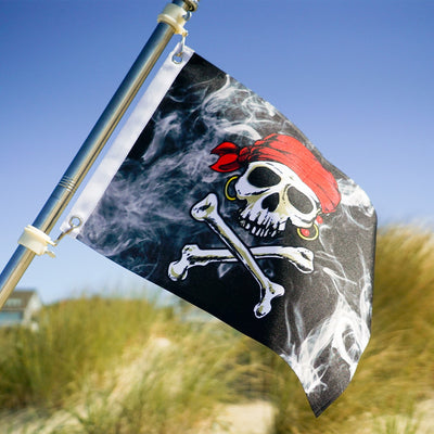 Smokin' Pirate Printed 12''x18'' double-sided grommet flag prominently displayed in an outdoor setting, featuring a bold pirate design.