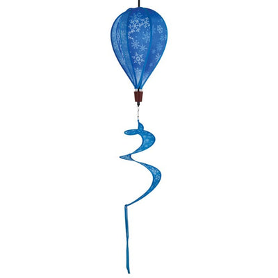 Snowflakes 6-Panel Hot Air Balloon spinner with a vibrant snowflake design, spinning gracefully in an outdoor winter setting, showcasing its festive charm.