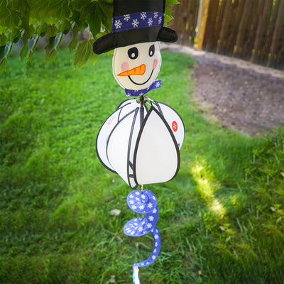 Snowman with Hat Hanging Ball Spinner in a garden setting, showcasing colorful panels and a cheerful, embroidered face, perfect for winter decoration.