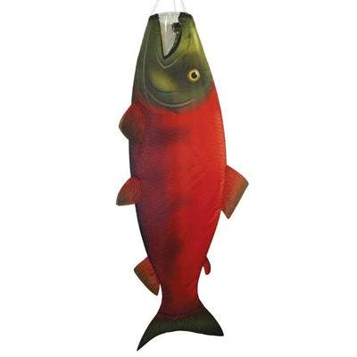 Sockeye Salmon 48-inch Fish Windsock featuring vibrant colors and detailed design, fluttering in the breeze at a marina.